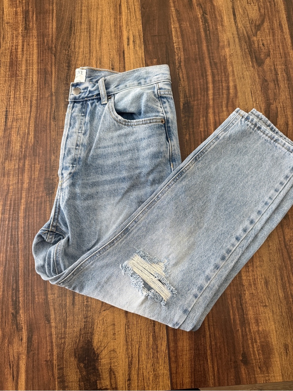 Women’s Straight Leg Light Blue Jeans with Knee Distress